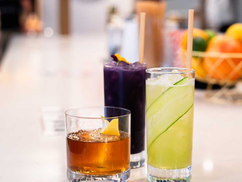 A photo of differently colored drinks